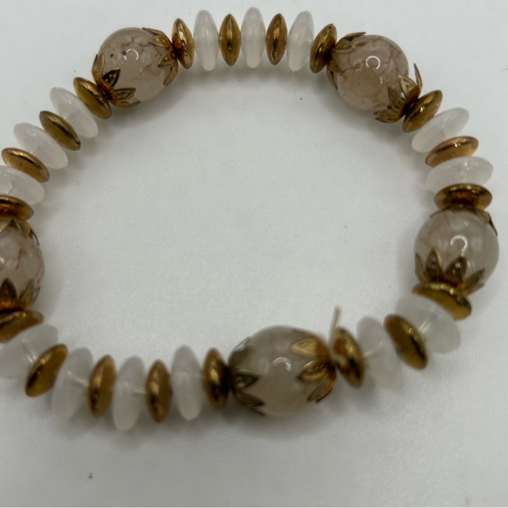 Women’s Bracelet gold and white stones.